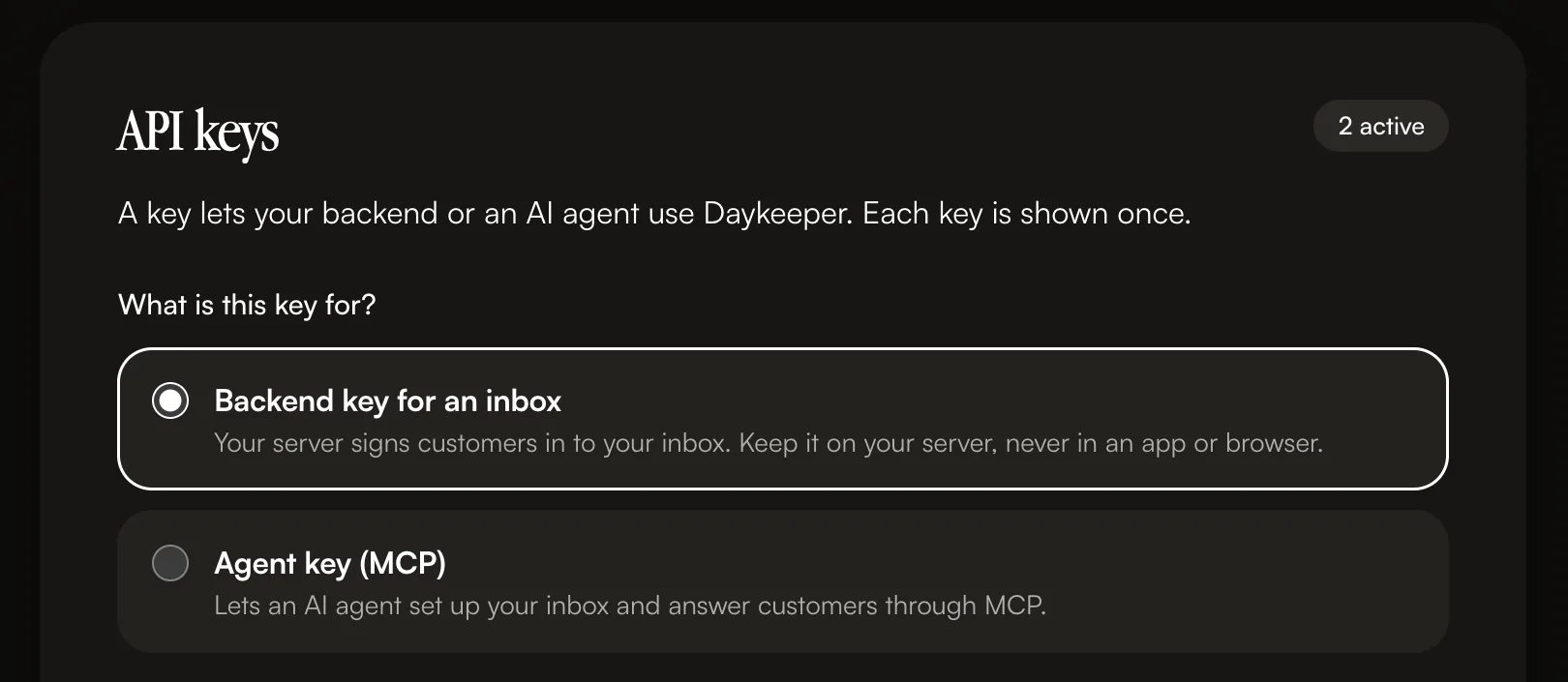 The Developers page of the Daykeeper console in dark mode: API keys, 2 active, with a choice between a backend key for an inbox and an agent key for MCP.